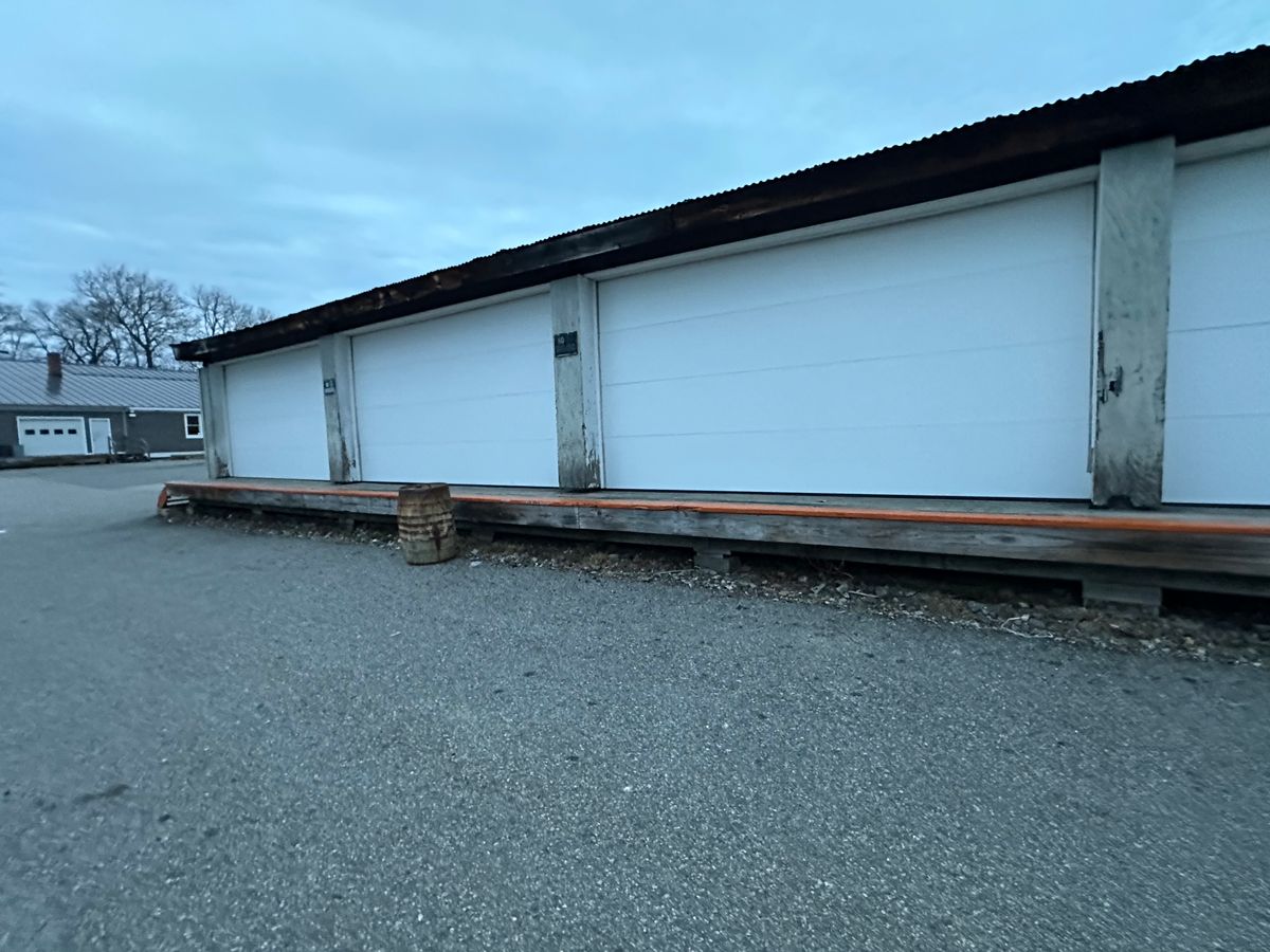 Two insulated garage doors installed in new construction home — interior view in MA